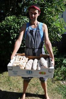 Me summer 2010, with (from left) fougasse, apple and oat loaf, alsace loaf with rye.