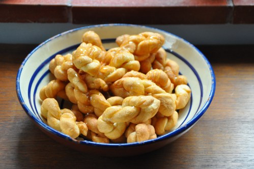 Acciuleddi, drizzled with honey